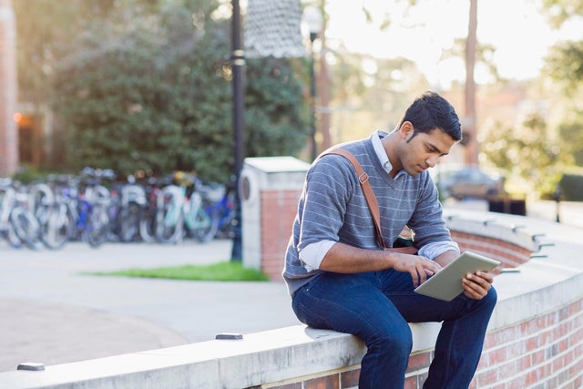 College student using tablet pc 