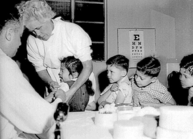 Children receive the polio vaccine - 1955 file photo 