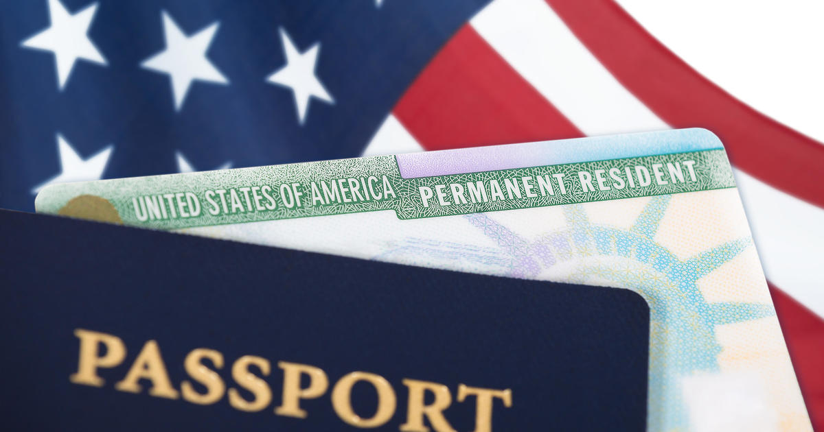 U.S. finalizes green card rules departing from strict Trump requirements – CBS News