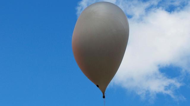 Man trying to pick pine nuts trapped aloft in hydrogen balloon for 2 days