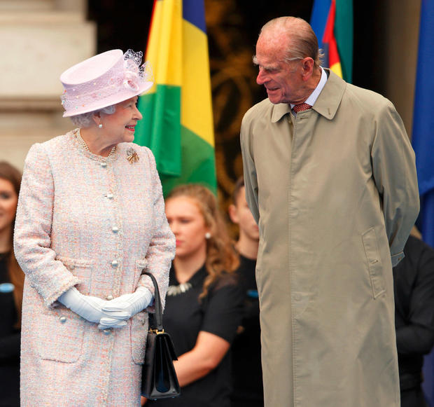 Queen Elizabeth II and Prince Philip, Duke of Edinburgh attend the launch of the Queen's Baton Relay at Buckingham Palace on October 9, 2013 in London, England. Following the launch, the baton relay will continue it's journey visiting all 70 competing nations and territories ahead of the 2014 Glasgow Commonwealth Games