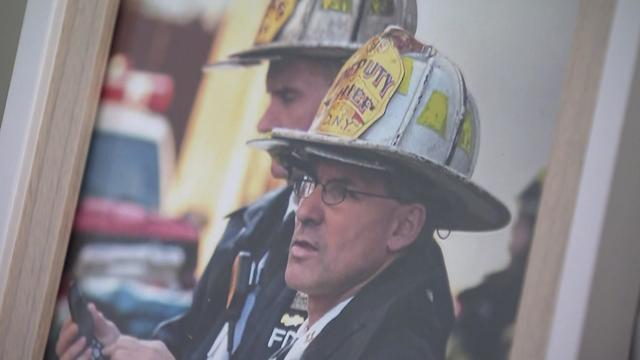 A frame photograph of Vincent "Vinny" Mandala in his firefighters uniform. 
