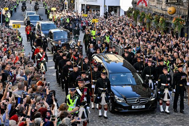 King Charles III and his siblings escort Queen Elizabeth II's coffin through Edinburgh