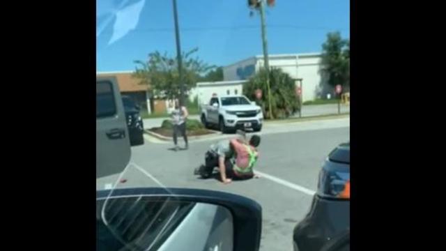 The Okaloosa County Sheriff's Office posted Twitter video of a Chick-fil-A worker scuffling with a would-be carjacker. 