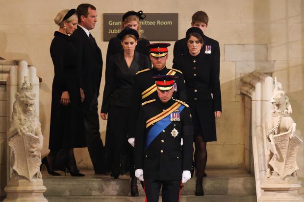 Britain's Prince William, Prince of Wales, leads his brother Prince Harry, Duke of Sussex, followed by their cousins Princess Beatrice of York and Princess Eugenie of York; Lady Louise Windsor and James, Viscount Severn; and Zara Tindall and Peter Phillips before mounting a vigil around the coffin of their grandmother Queen Elizabeth II, in Westminster Hall, at the Palace of Westminster in London on Sept. 17, 2022, ahead of her funeral on Monday