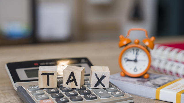 Tax on Wooden Blocks on Top of Work Desk Space 