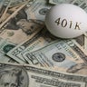 American currency and an egg with '401K' on it 