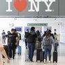 Travelers at John F. Kennedy International Airport (JFK) in the Queens borough of New York, US, on Friday, July 1, 2022. 