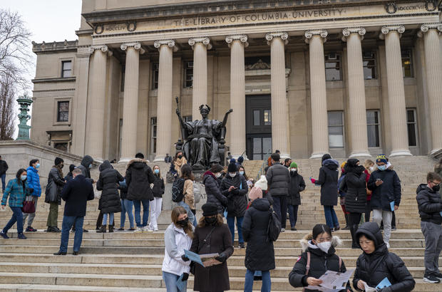 Prospective students wait for a tour to begin February 24, 2022 on the campus of Columbia University in New York City. 