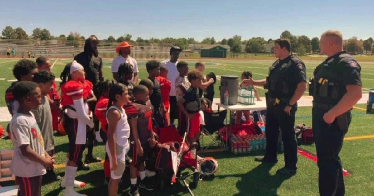 Aurora police help youth football team, ask for community support CBS