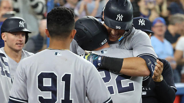 New York Yankees designated hitter Aaron Judge (99) hits his 61st home run, a two run shot, of the season to tie Roger Maris as the Toronto Blue Jays play the New York Yankees at Rogers Centre in Toronto. 