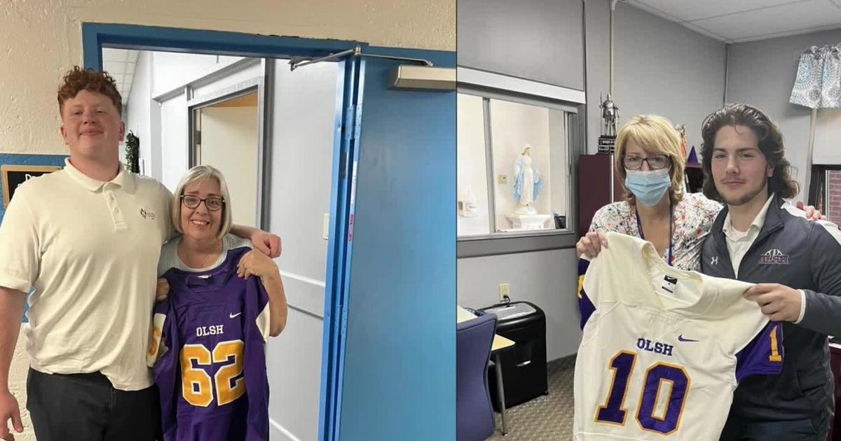 Football players give jerseys to favorite teachers