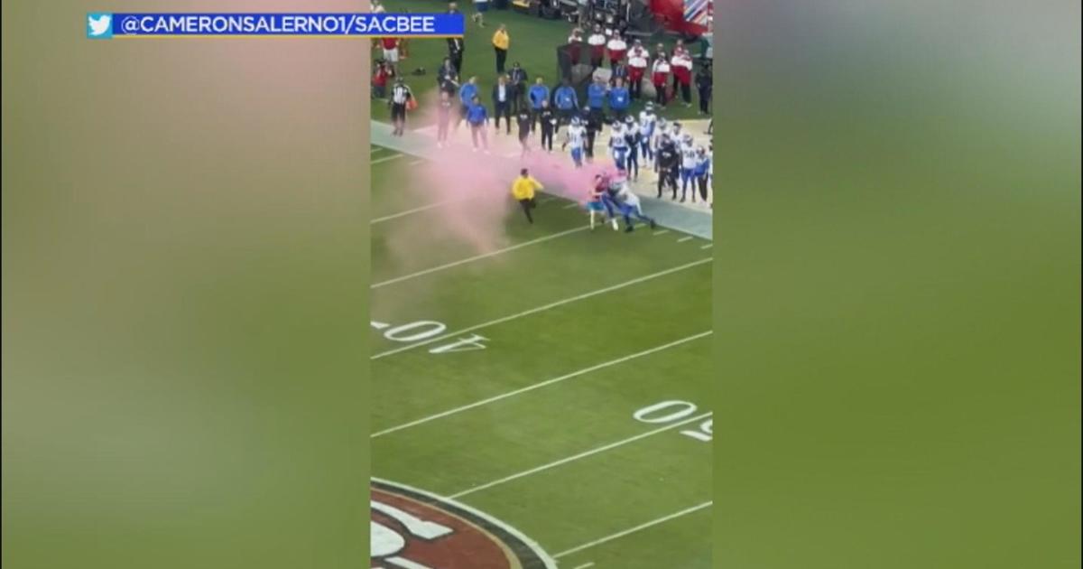 Streaker tackled by Rams linebacker during game against 49ers