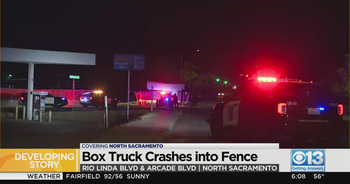 Box truck crashes into fence in North Sacramento