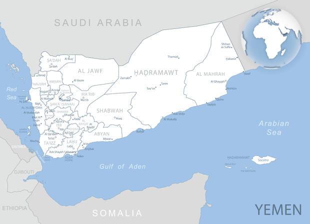 Blue-gray detailed map of Yemen administrative divisions and location on the globe. 