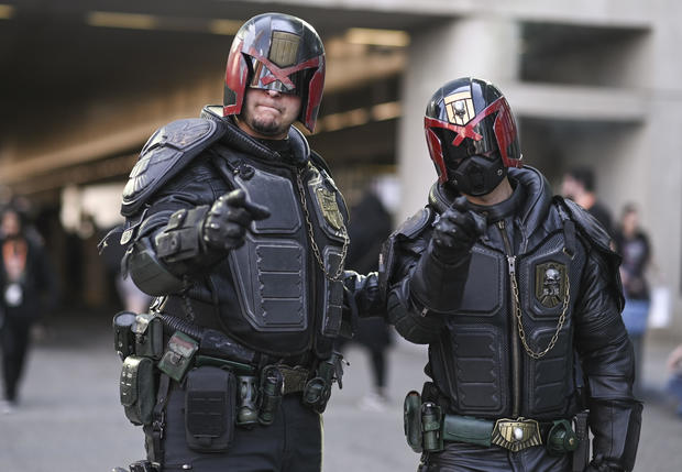 Cosplayers pose as Judge Dredd cops during day 1 of New York Comic Con on October 06, 2022 in New York City. 