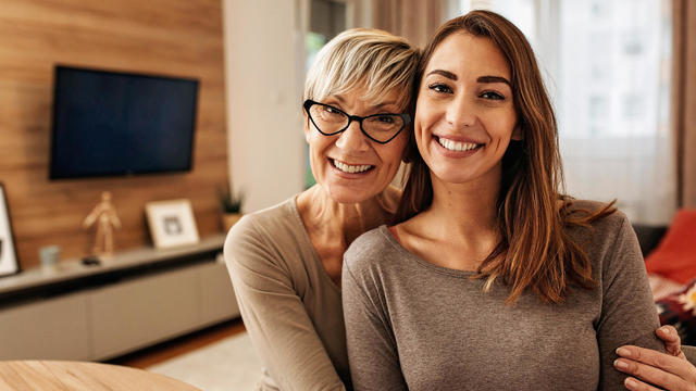 Portrait of a Caucasian mother and daughter bonding at home 