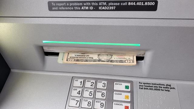 ATM Dispensing Cash 