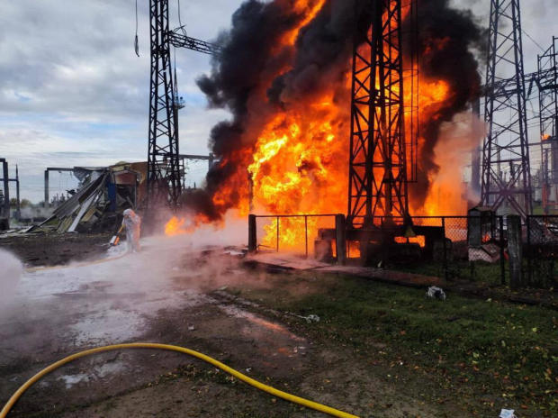 Firefighters work to put out a fire at energy infrastructure facilities damaged by a Russian missile strike as Russia's attack on Ukraine continues, in an undisclosed location in Ukraine, Oct. 22, 2022. 