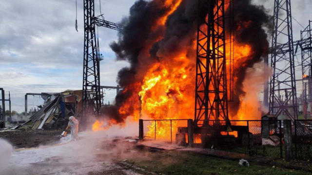 Firefighters work to put out a fire at energy infrastructure facilities damaged by a Russian missile strike as Russia's attack on Ukraine continues, in an undisclosed location in Ukraine, Oct. 22, 2022. 