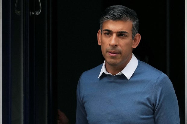 Conservative MP Rishi Sunak leaves his home address in London 