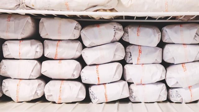 Stacks of frozen ground beef in the freezer. 