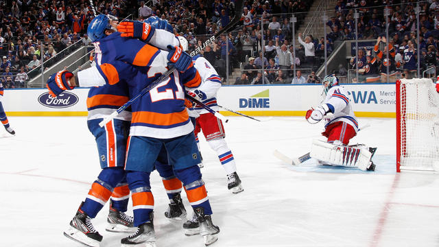The New York Islanders celebrate a second period goal by Kyle Palmieri #21 against Jaroslav Halak #41 of the New York Rangers at the UBS Arena on October 26, 2022 in Elmont, New York. 