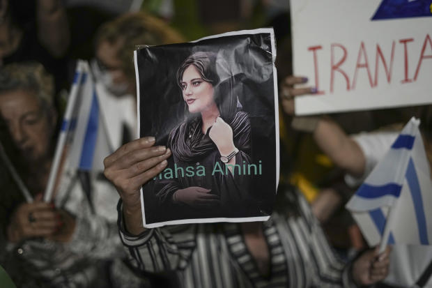 Women attend a protest against the death of Mahsa Amini, a woman who died while in police custody in Iran, during a rally in Tel Aviv, Israel, Oct. 29, 2022. 
