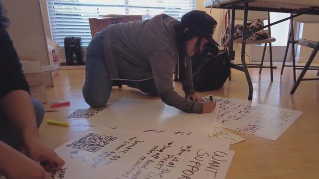 UC school system student workers make signs for a potential strike 