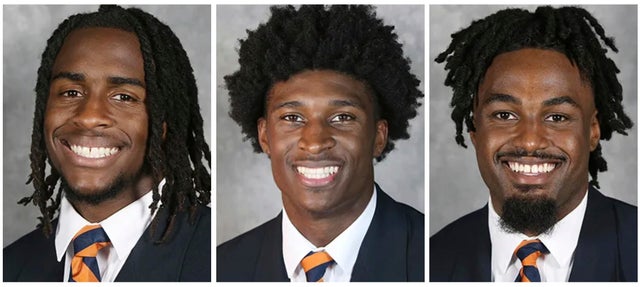 From left, college football players Devin Chandler, Lavel Davis Jr. and D'Sean Perry are seen in a combination photo of undated images provided by University of Virginia Athletics.