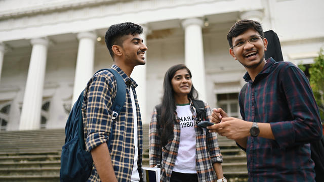 Students standing and talking in the University campus 