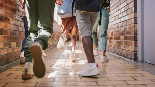 School children running in hallway 