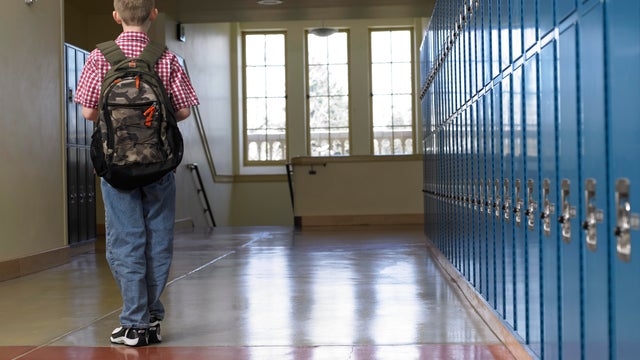 School children running in hallway 