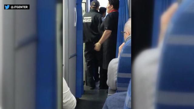 Video shows police officers boarding an airport. 