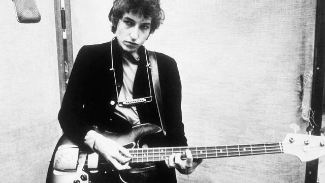 Bob Dylan Holding Bass Guitar 