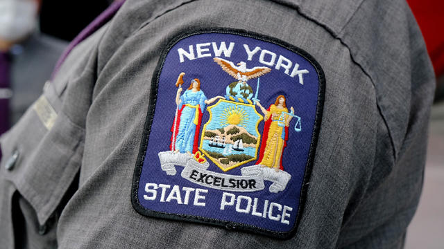 A New York State Police patch is seen on a State Trooper's arm inside the Jacob Javits Convention Center on Jan. 13, 2021. 
