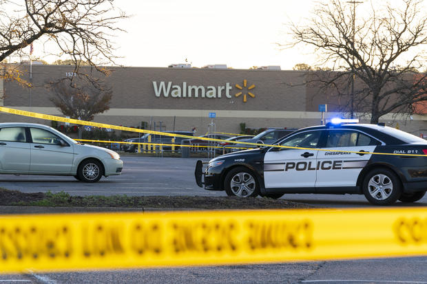 Law enforcement work the scene of a mass shooting at a Walmart, Nov. 23, 2022, in Chesapeake, Virginia. 