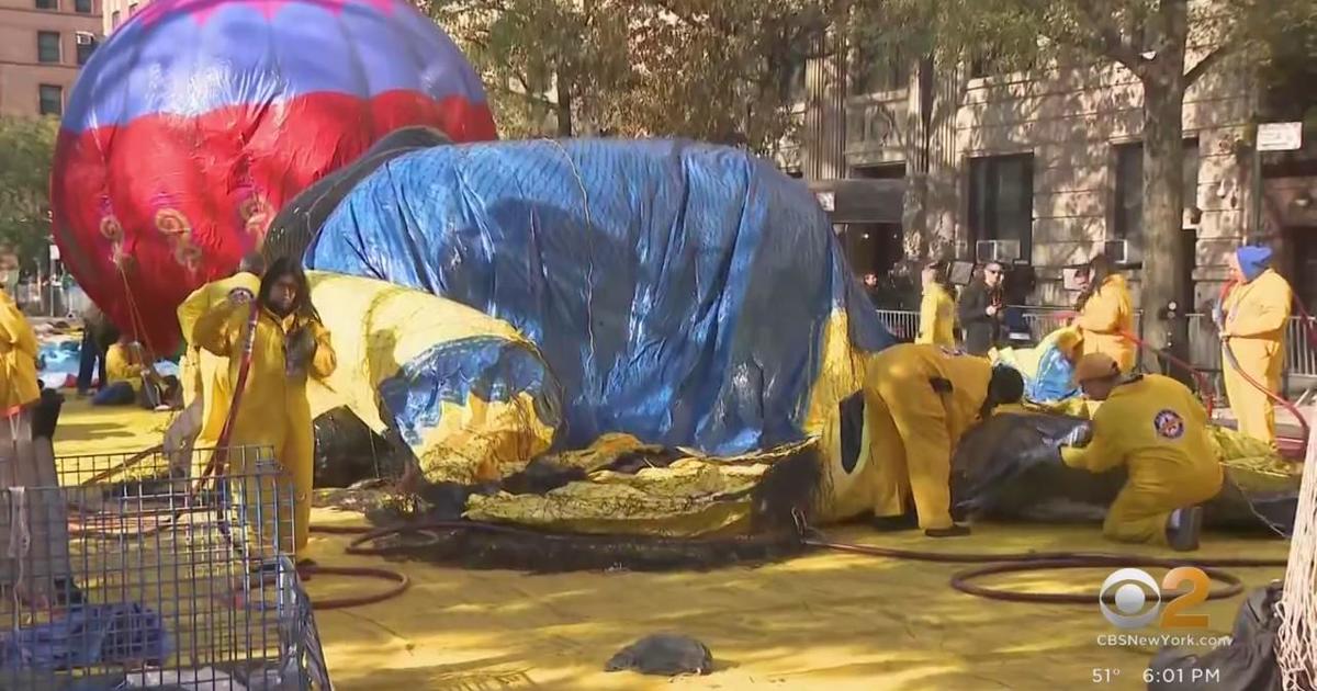 Crowds gather for Macy's Thanksgiving Day Parade balloon inflation