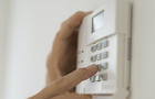 USA, New Jersey, Jersey City, Hand setting code on burglar alarm 