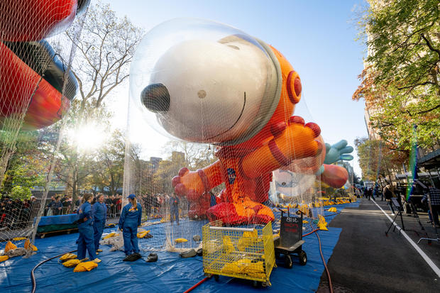 The Snoopy in a space suit balloon is being inflated during the 96th Macy's Thanksgiving Day Parade balloon inflation at Central Park on November 23, 2022 in New York City. 