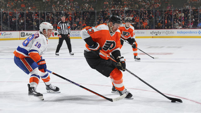 Kevin Hayes #13 of the Philadelphia Flyers controls the puck against Anthony Beauvillier #18 of the New York Islanders in the second period at the Wells Fargo Center on November 29, 2022 in Philadelphia, Pennsylvania. 