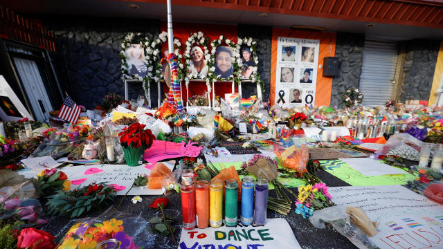 Flowers, candles and mementos are left at a memorial after a mass shooting at LGBTQ nightclub Club Q in Colorado Springs, Colorado, November 26, 2022. 