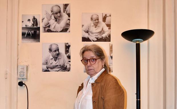 Magda Haroun with photos of her father 