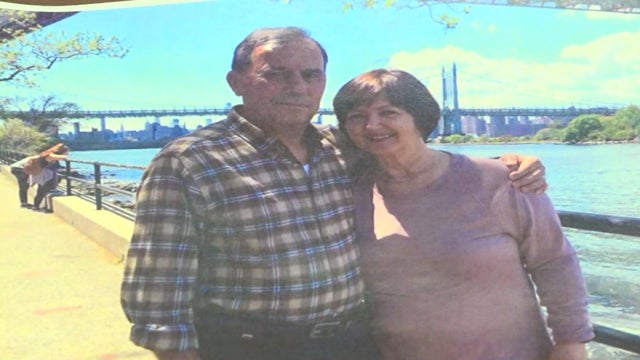 A photo of Genci Frasheri and a woman standing on a riverside pathway in New York City. 