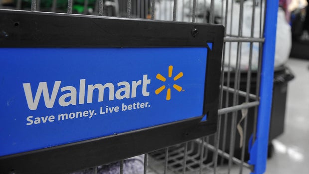 A Walmart worker packing up a grocery delivery 