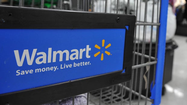 A Walmart worker packing up a grocery delivery