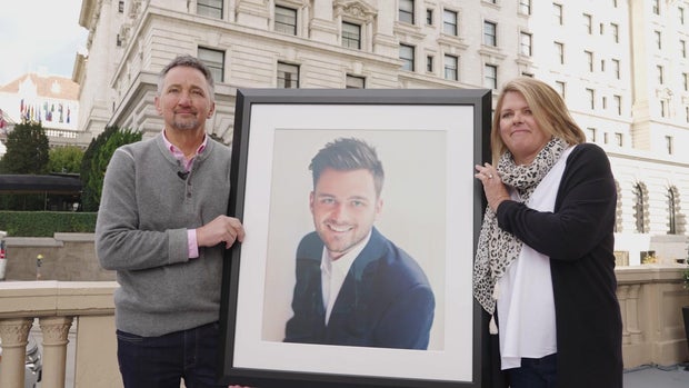 Jim and Colette Grabow with a photo of their son, Barrett