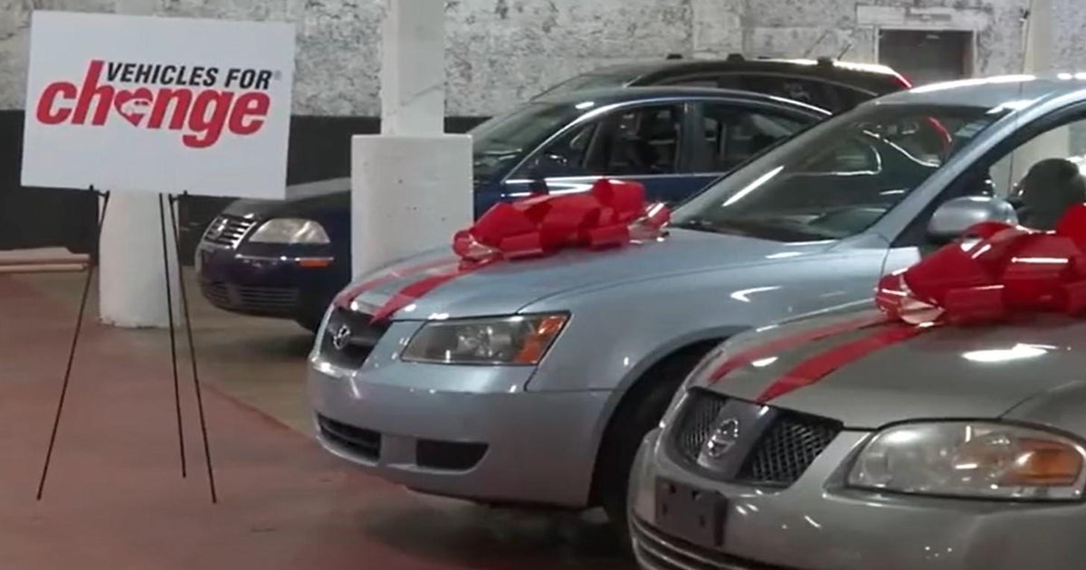 Nonprofit Vehicles for Change hand families in need keys to car just in