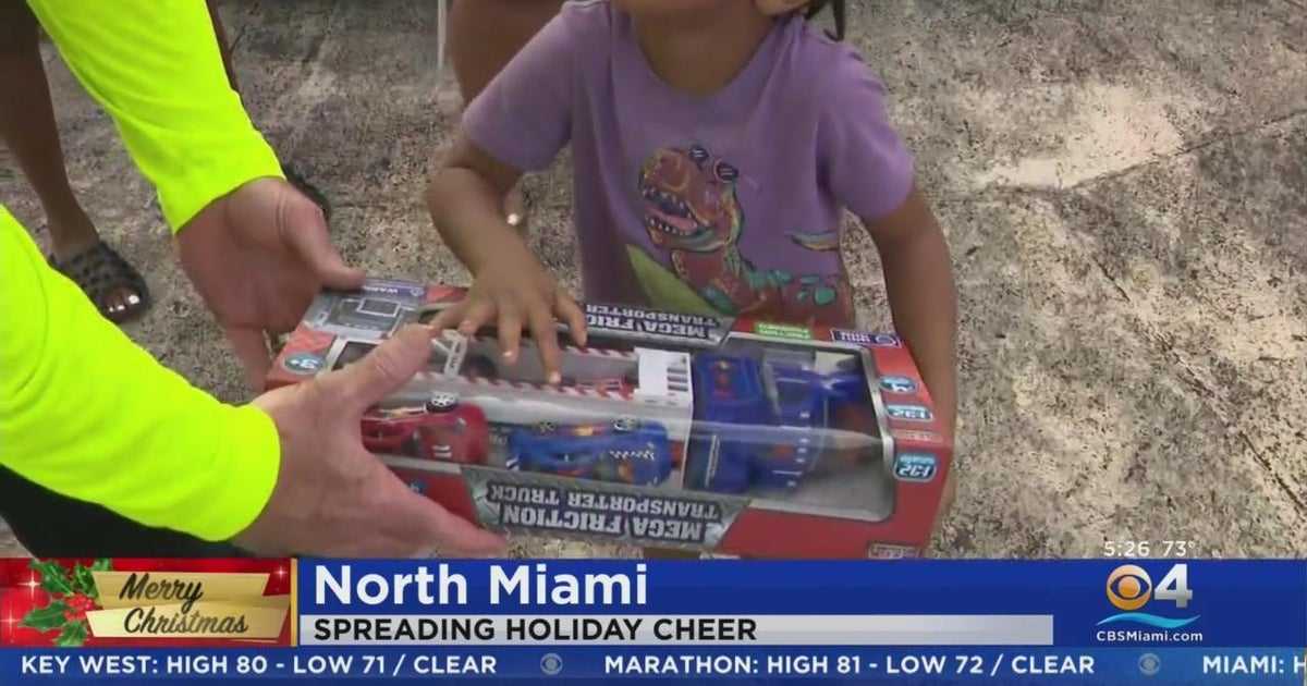 North Miami law enforcement SWAT handed out toys to small children