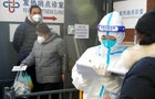 People line up to receive treatment at clinic in Shanghai, China 